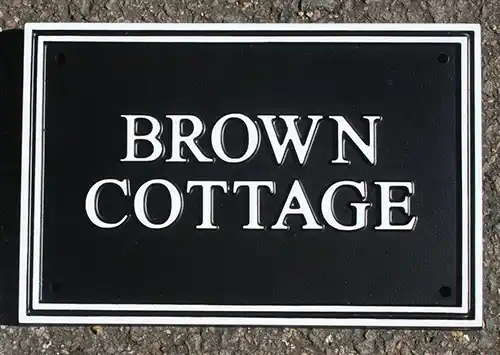 Cast rectangular house sign