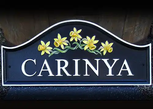 Dome top cast house sign with motif