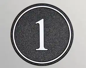 title here Round cast house number sign