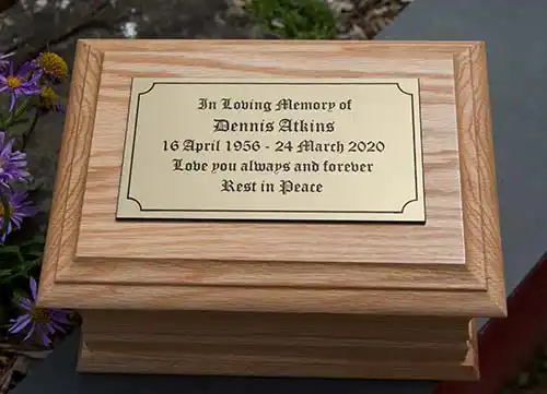 Standard oak casket with gold acrylic plaque