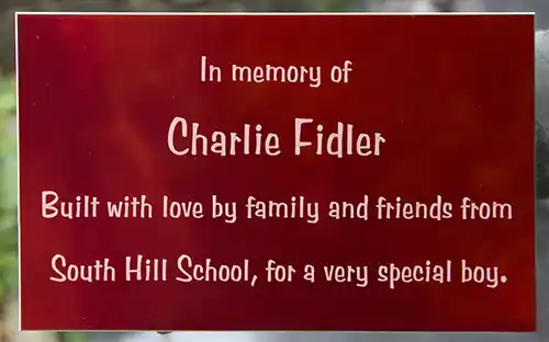 Red aluminium memorial plaque