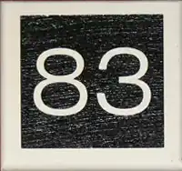 Raised wooden house number