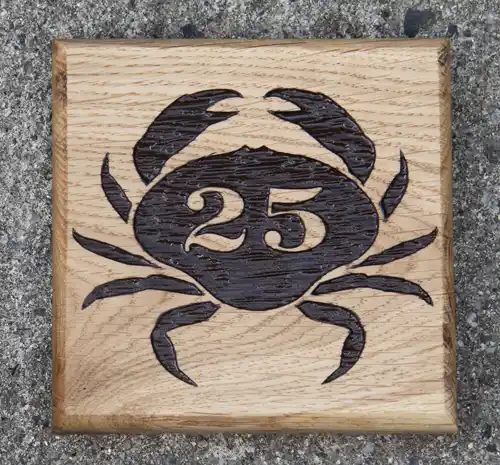 Wooden house number sign with image
