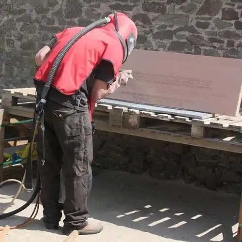 Sandblasting the wording onto a slate doorstep. Sand Blasting Slate Doorstep