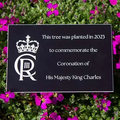 This engraved plaque was made to commerorate the Coronation of King Charles. Black/White Engraved Acrylic Plaque