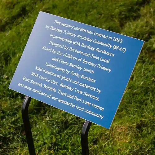 This plaque was fixed to a wrought Iron plate with tree stakes Blue/White Engraved Acrylic Plaque