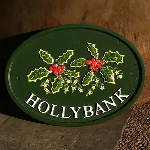 The motif has extra flowers painted on it Cast Oval House Sign